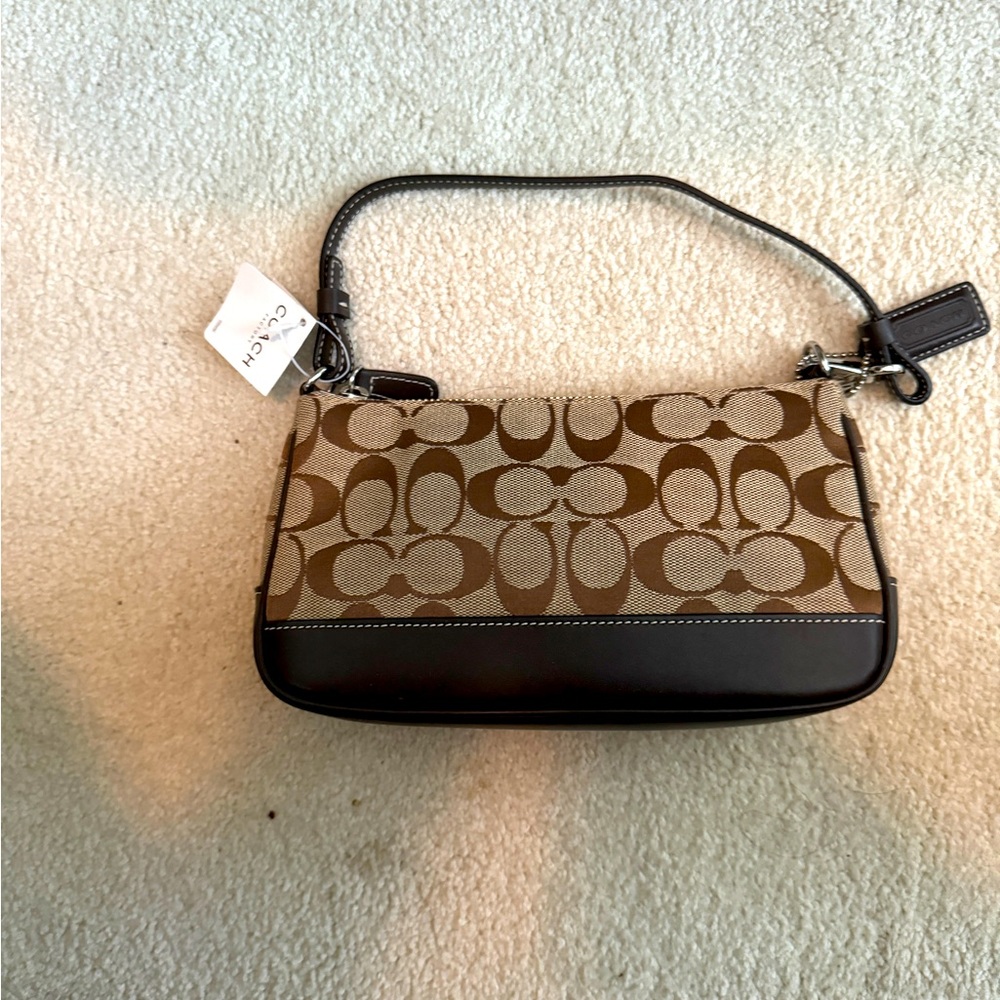 Never used Coach small under arm bag.